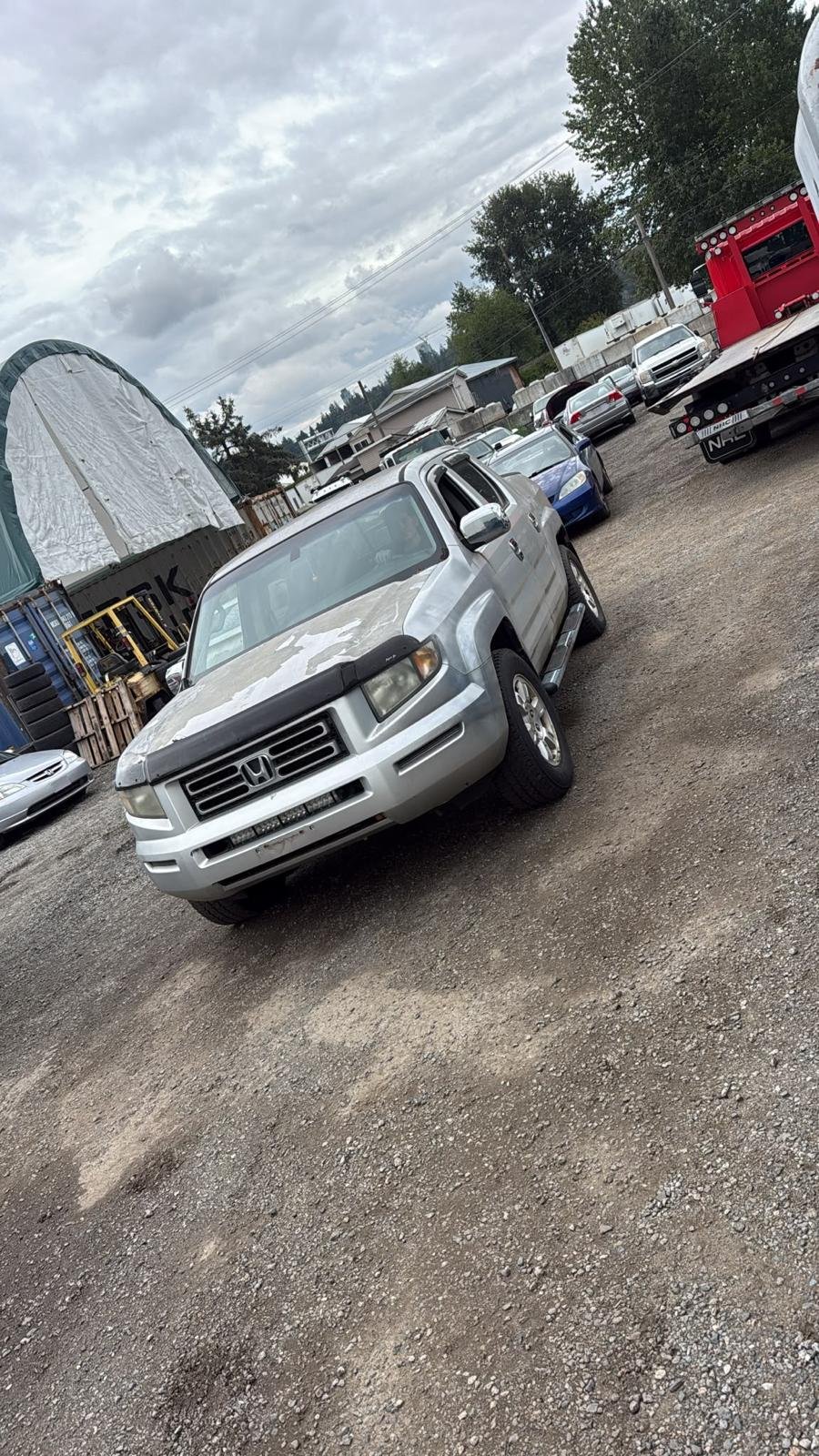 Scrap car removal in Cloverdale, Surrey — vehicle loaded onto a flatbed tow truck for cash