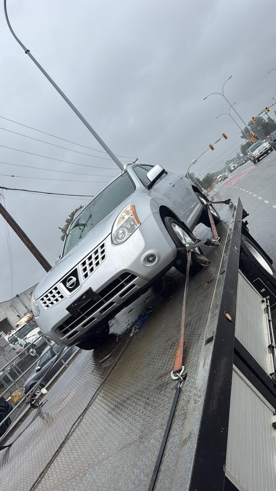 Auto recycling pickup in Cloverdale, Surrey — scrap car on the flatbed deck
